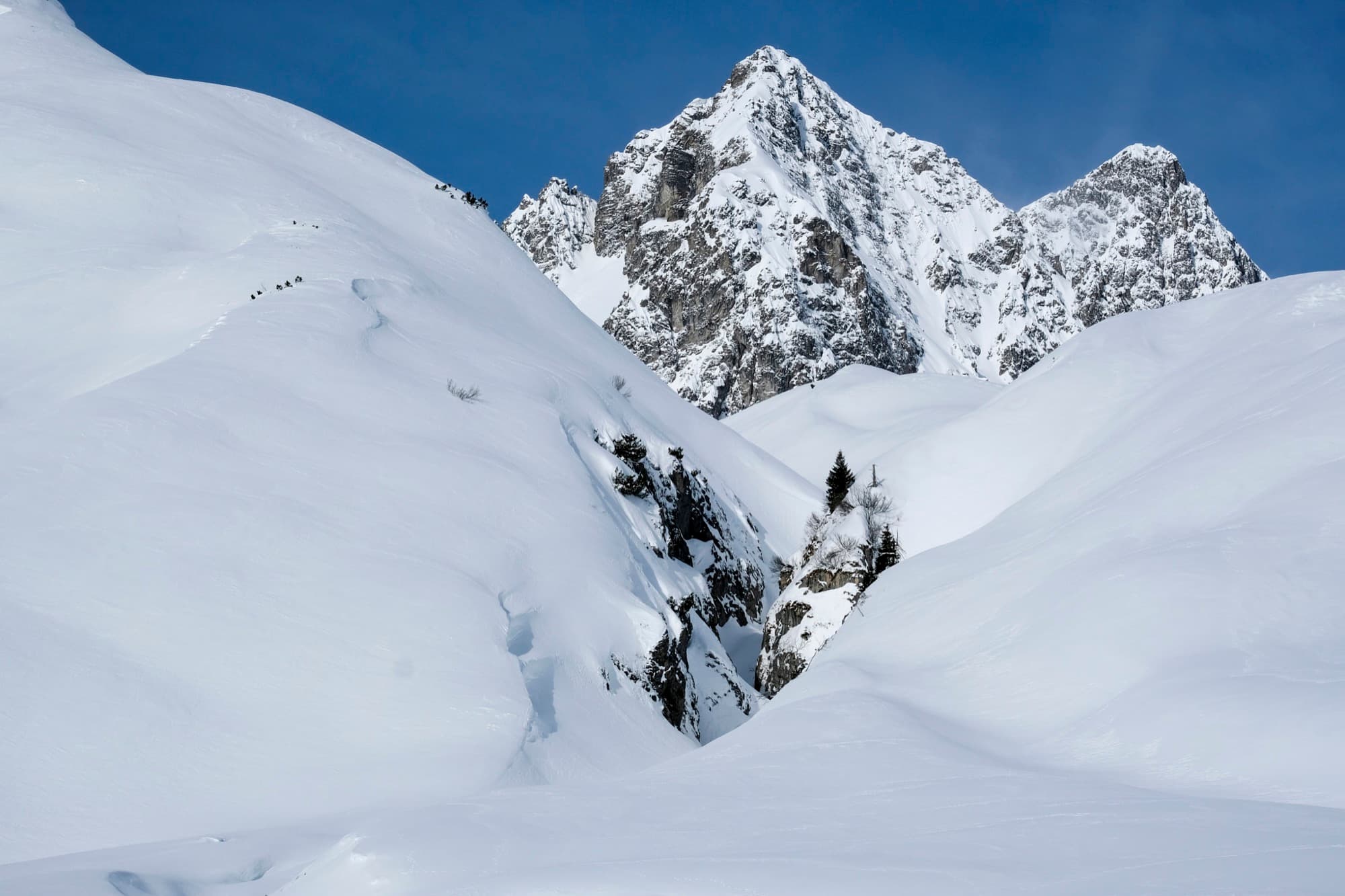 Dramatic rocky peaks above deep snow in the Arlberg